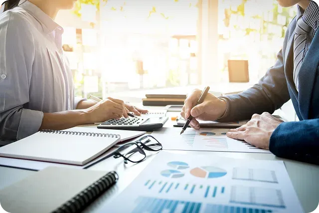 Accounting professionals reviewing financial charts together
